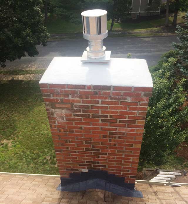 Close up of chimney crown rebuild with freshly poured crown