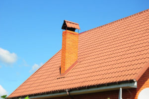 red roof and chimney with flashing