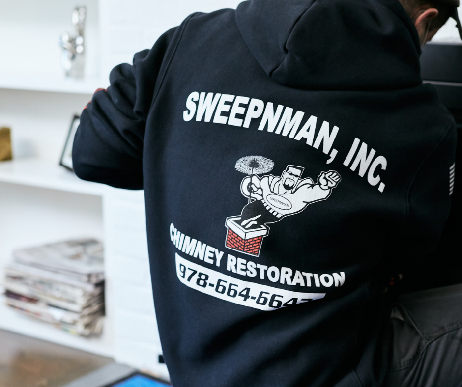 Sweepnman logo on tech's shirt